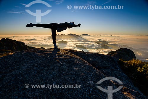  Woman practicing Yoga - virabhadrasana C movement (warrior III) - trail to Pedra do Sino (Bell Stone) - Serra dos Orgaos National Park  - Teresopolis city - Rio de Janeiro state (RJ) - Brazil