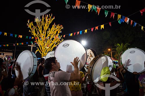  Reveler playing tambourine during party of the Death of Ox - time of death of the main character of the Bumba-meu-boi  - Sao Jose de Ribamar city - Maranhao state (MA) - Brazil