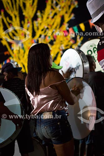  Woman playing tambourine during party of the Death of Ox - time of death of the main character of the Bumba-meu-boi  - Sao Jose de Ribamar city - Maranhao state (MA) - Brazil