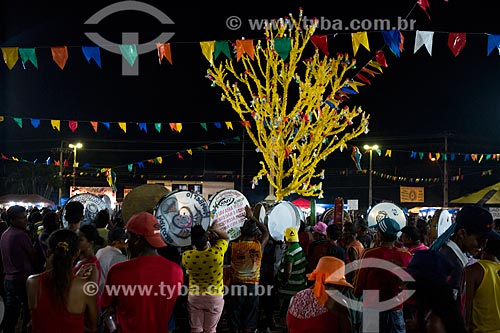  Reveler playing tambourine during party of the Death of Ox - time of death of the main character of the Bumba-meu-boi  - Sao Jose de Ribamar city - Maranhao state (MA) - Brazil