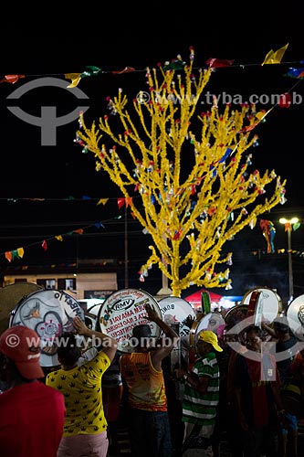  Reveler playing tambourine during party of the Death of Ox - time of death of the main character of the Bumba-meu-boi  - Sao Jose de Ribamar city - Maranhao state (MA) - Brazil