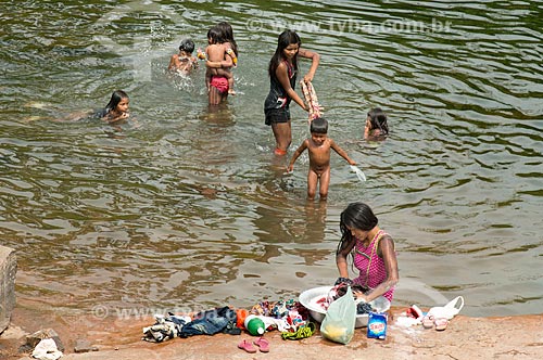  Indian woman washing clothes - Riozinho River - with children indian taking bath - Moikarako Tribe - Kayapo Indigenous Land  - Sao Felix do Xingu city - Para state (PA) - Brazil