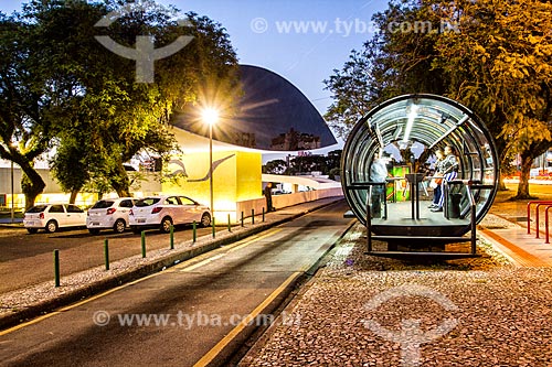  Tubular station of articulated buses - also known as the Tube Station - with the Oscar Niemeyer Museum in the background  - Curitiba city - Parana state (PR) - Brazil