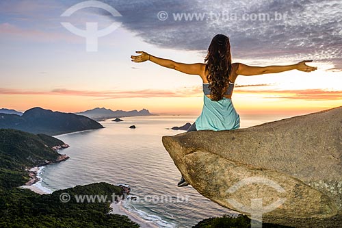  Woman observing the Rio de Janeiro waterfront from the Pedra do Telegrafo (Telegraph Stone) - Guaratiba Mountain during the dawn  - Rio de Janeiro city - Rio de Janeiro state (RJ) - Brazil