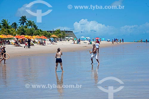  Couple playing matkot - Tambau Beach waterfront with the Tropical Tambau Hotel  - Joao Pessoa city - Paraiba state (PB) - Brazil