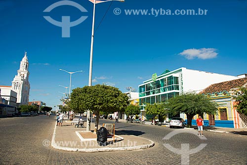 View of the Coronel Joao Santa Cruz Street with the Nossa Senhora das Dores Church - to the left - and Bormoratt Mall - to the right  - Monteiro city - Paraiba state (PB) - Brazil