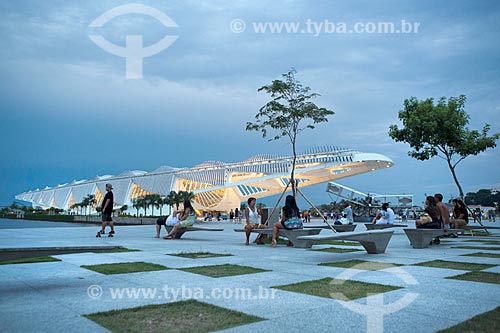  People sitting in lawn of the Maua Square with the Amanha Museum (Museum of Tomorrow) in the background  - Rio de Janeiro city - Rio de Janeiro state (RJ) - Brazil