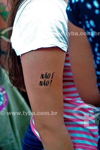  Protester with a tattoo that says: It is not no - during manifestation the International Womens Day  - Rio de Janeiro city - Rio de Janeiro state (RJ) - Brazil