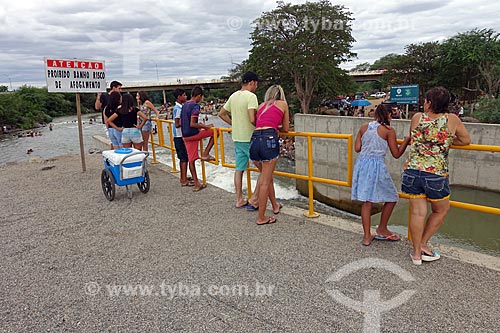  People observing the spillway pouring water into the Paraiba River - Project of Integration of Sao Francisco River  - Monteiro city - Paraiba state (PB) - Brazil