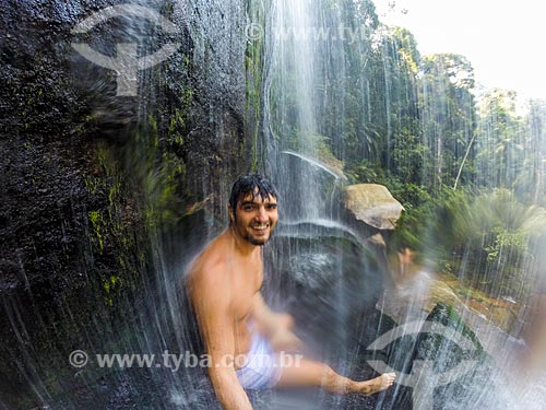  Bather make a selfie - waterfall - Guapiacu Ecological Reserve  - Cachoeiras de Macacu city - Rio de Janeiro state (RJ) - Brazil