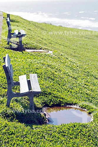  Park bench and puddle - Farol Hill (Lighthouse Hill) mirante  - Torres city - Rio Grande do Sul state (RS) - Brazil
