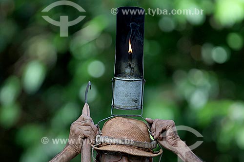 Detail of poronga - typical lamp used by rubber tappers - during the collection of latex - Our Lady of Fatima riparian community  - Manaus city - Amazonas state (AM) - Brazil