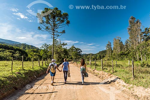  People - walking on dirt road of the Visconde de Maua district rural zone  - Resende city - Rio de Janeiro state (RJ) - Brazil