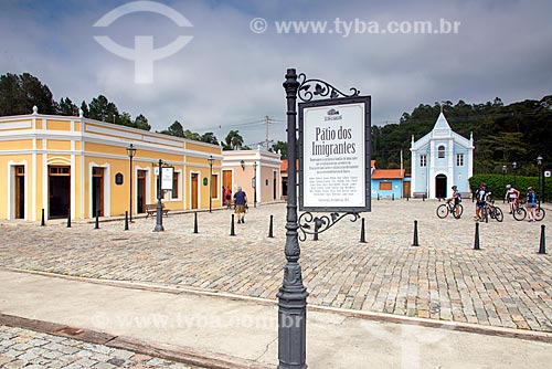  View of the historic houses - Patio dos Imigrantes (Immigrants Courtyard square) - with the Saint Lawrence Church (1906) in the background  - Guararema city - Sao Paulo state (SP) - Brazil