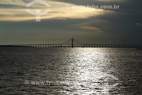  View of Negro River with the Negro River Bridge in the background during the sunset  - Manaus city - Amazonas state (AM) - Brazil