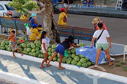  Watermelon (Citrullus lanatus) to sale - commercial street of Parintins city - sidewalks painted blue (Boi Caprichoso)  - Parintins city - Amazonas state (AM) - Brazil