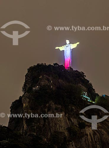  Christ the Redeemer with special lighting - yellow, blue and red - due to the commemoration of Ecuador 208 years of independence  - Rio de Janeiro city - Rio de Janeiro state (RJ) - Brazil
