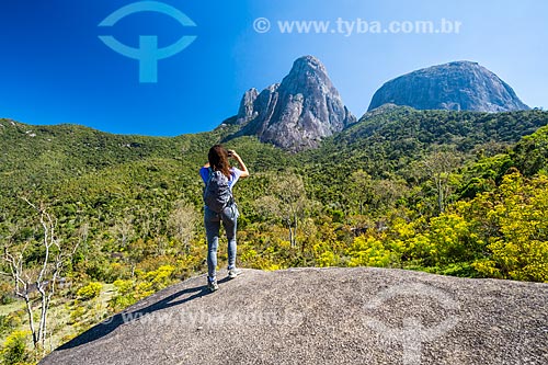  Tourist photographing the Tres Picos de Salinas (Three Peaks of Salinas) - Tres Picos State Park  - Teresopolis city - Rio de Janeiro state (RJ) - Brazil