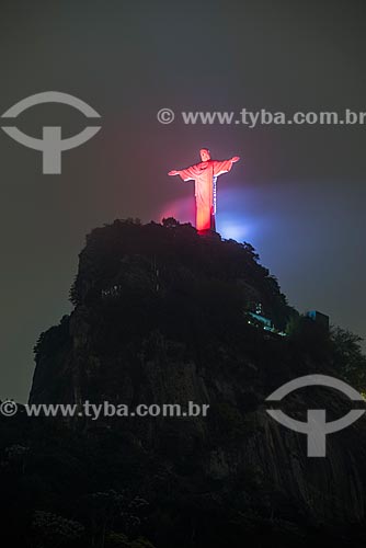  Christ the Redeemer (1931) Monument with special lighting - red - due to the National Day to Combat Vascular Disease  - Rio de Janeiro city - Rio de Janeiro state (RJ) - Brazil