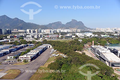  Aerial photo of runway of the Roberto Marinho Airport - also known as Jacarepagua Airport - with the Rock of Gavea in the background  - Rio de Janeiro city - Rio de Janeiro state (RJ) - Brazil