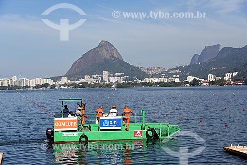  Ecoboat - boat with equipment that collects floating solid waste in the water - Rodrigo de Freitas Lagoon with the Morro Dois Irmaos (Two Brothers Mountain) in the background  - Rio de Janeiro city - Rio de Janeiro state (RJ) - Brazil