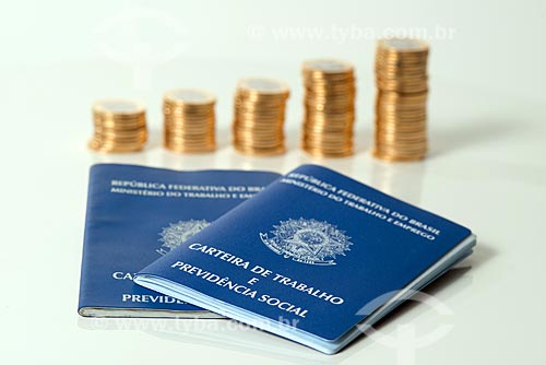  Brazilian currency - Real - coins of 1 real stacked with work permit  - Rio de Janeiro city - Rio de Janeiro state (RJ) - Brazil