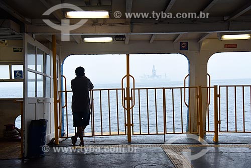  Silhouette of man inside of barge that makes crossing between Rio de Janeiro and Paqueta Island  - Rio de Janeiro city - Rio de Janeiro state (RJ) - Brazil