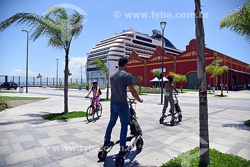  Cyclists and people doing trikke tour ride with the cruise ship and warehouses of Gamboa Pier - Rio de Janeiro Port - Mayor Luiz Paulo Conde Waterfront (2016)  - Rio de Janeiro city - Rio de Janeiro state (RJ) - Brazil