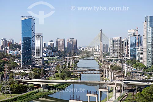  View of snippet of the Pinheiros River with the Octavio Frias de Oliveira Brigde (2008) in the background  - Sao Paulo city - Sao Paulo state (SP) - Brazil