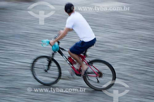  Detail of man riding bicycles - Pirenopolis city historic center  - Pirenopolis city - Goias state (GO) - Brazil