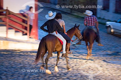  Couple riding a horse - Pirenopolis city historic center  - Pirenopolis city - Goias state (GO) - Brazil