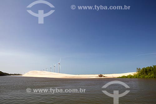  View of the Paranaiba River with the Pedra do Sal Wind Farm (Stone of Salt Wind Farm) - Parnaiba Delta - in the background  - Ilha Grande city - Piaui state (PI) - Brazil