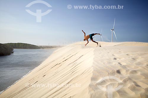  Man doing somersault - dunes of the Parnaiba Delta  - Ilha Grande city - Piaui state (PI) - Brazil