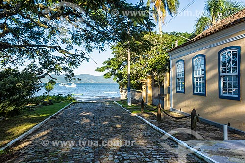  View of street - Enseada de Brito district with the South Bay in the background  - Palhoca city - Santa Catarina state (SC) - Brazil