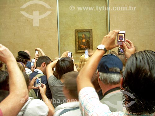 People photographing the picture Mona Lisa - also known as La Gioconda - by Leonardo da Vinci on exhibit - Musée du Louvre (Louvre Museum)  - Paris - Paris department - France