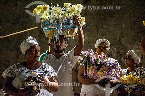  Man taking offering during the festival of Yemanja in Salvador city  - Salvador city - Bahia state (BA) - Brazil