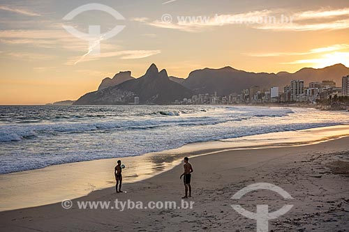  Bathers playing soccer - Ipanema Beach waterfront - during the sunset with the Rock of Gavea and Morro Dois Irmaos (Two Brothers Mountain) in the background  - Rio de Janeiro city - Rio de Janeiro state (RJ) - Brazil