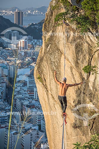  Practitioner of slackline - Cantagalo Hill with the Copacabana neighborhood in the background  - Rio de Janeiro city - Rio de Janeiro state (RJ) - Brazil