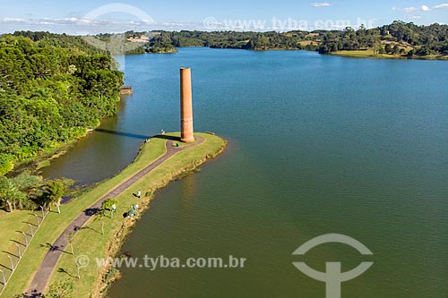  Picture taken with drone of the chimney of old pottery on the banks of the Passauna Park dam  - Curitiba city - Parana state (PR) - Brazil