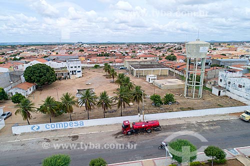  Picture taken with drone of water truck fueling - water tank of COMPESA (Sanitation Company Pernambucana)  - Cabrobo city - Pernambuco state (PE) - Brazil