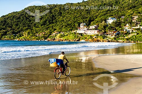  Man riding bicycles - Lagoinha Beach waterfront  - Florianopolis city - Santa Catarina state (SC) - Brazil