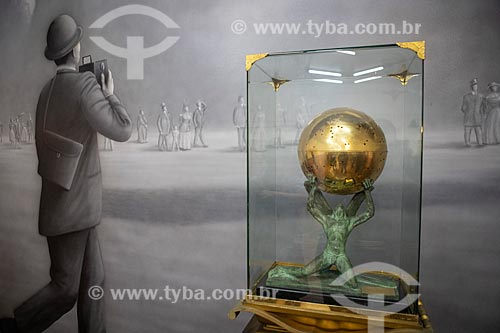  Detail of urn as a golden globe containing the embalmed heart of Alberto Santos Dumont with bronze figurine of the god Icarus - part of the permanent collection of the Aerospace Museum  - Rio de Janeiro city - Rio de Janeiro state (RJ) - Brazil