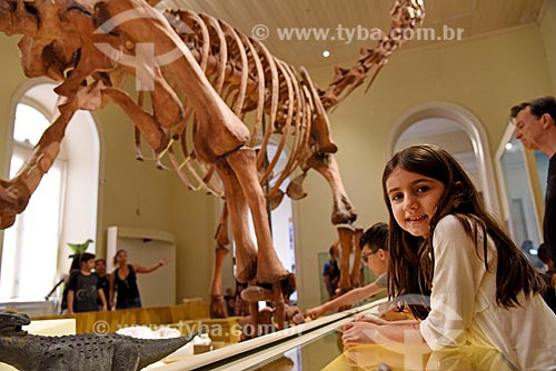  Woman observing replica of titanosaur fossil on exhibit - National Museum - old Sao Cristovao Palace  - Rio de Janeiro city - Rio de Janeiro state (RJ) - Brazil