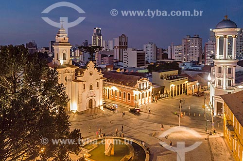  Picture taken with drone of the Our Lady of Rosario de Sao Benedito Church (1946) with the Independent Presbyterian Church of Curitiba - to the right - during the nightfall  - Curitiba city - Parana state (PR) - Brazil