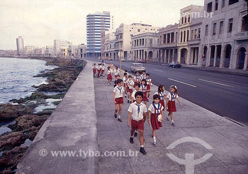  Children in school uniform - El Malecón - officially Maceo Avenue - 1980s  - Habana city - Ciudad de La Habana province - Cuba