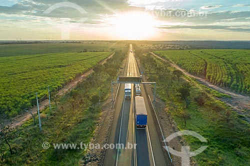  Picture taken with drone of snippet of the Transbrasiliana Highway (BR-153) - also known as Belem-Brasilia Highway and Bernardo Sayao Highway - during the sunset  - Comendador Gomes city - Minas Gerais state (MG) - Brazil
