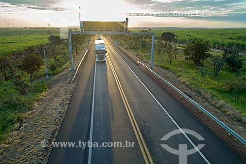  Picture taken with drone of snippet of the Transbrasiliana Highway (BR-153) - also known as Belem-Brasilia Highway and Bernardo Sayao Highway - during the sunset  - Comendador Gomes city - Minas Gerais state (MG) - Brazil