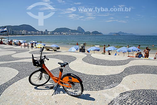 Public bicycle - for rent - boardwalk of the Copacabana Beach - Post 6 - with the Sugarloaf in the background  - Rio de Janeiro city - Rio de Janeiro state (RJ) - Brazil