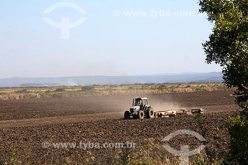  Tractor plowing the soil for rice planting - San Domingos Farm  - Miranda city - Mato Grosso do Sul state (MS) - Brazil