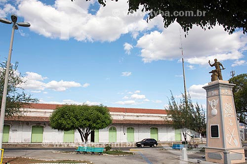  View of the old Baturite Railway Train Station (1891) with the Monument to work - to the right  - Quixada city - Ceara state (CE) - Brazil